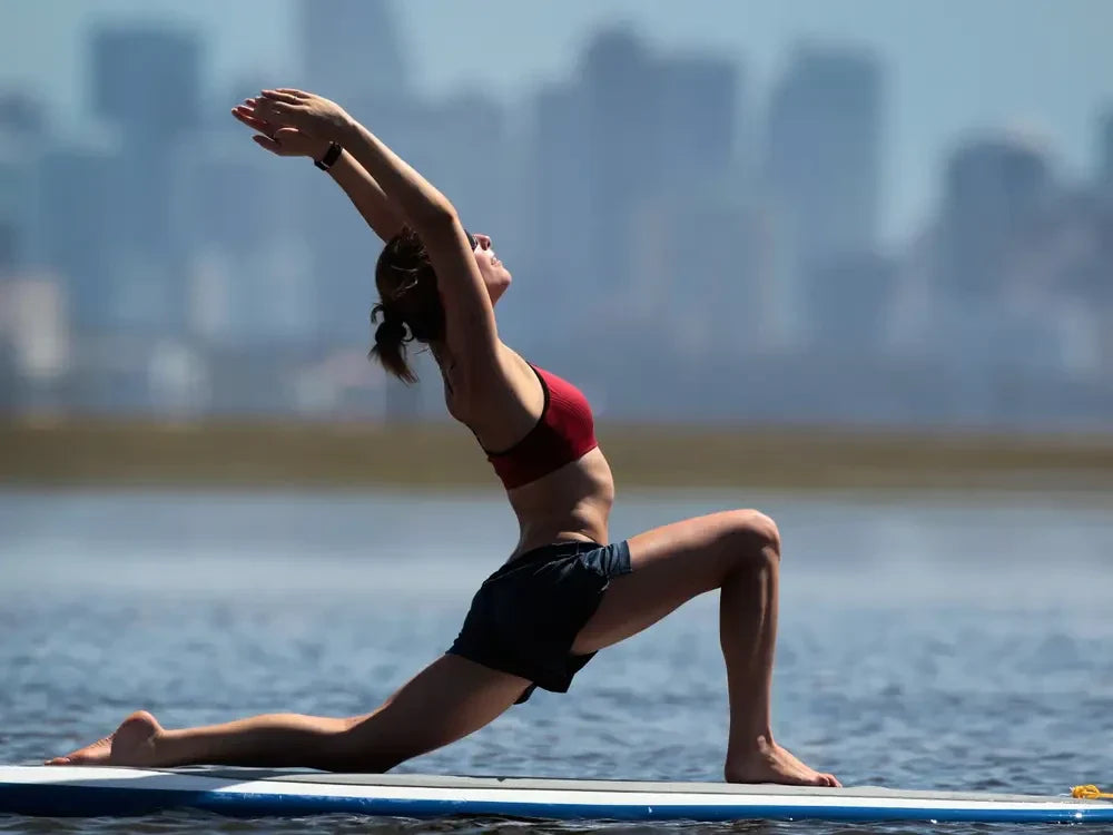 A woman stretching her body to maintain a healthy physique.