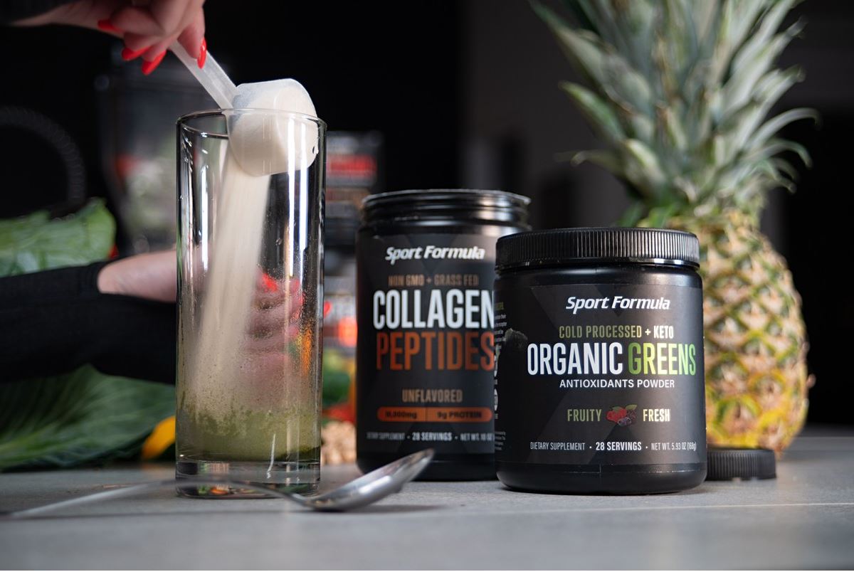 Image of collagen peptides and organic greens being added to a glass bottle.