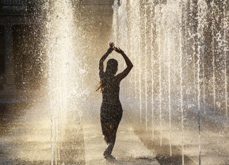 A woman dancing in the rain