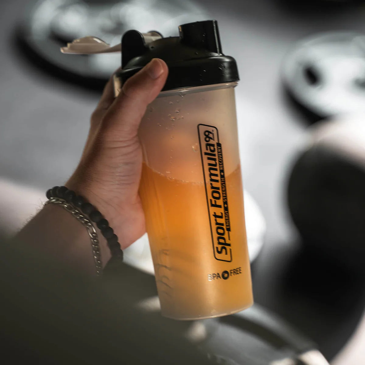 Holding a shaker bottle.