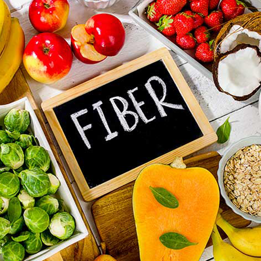 Fiber text with healthy food in the background.