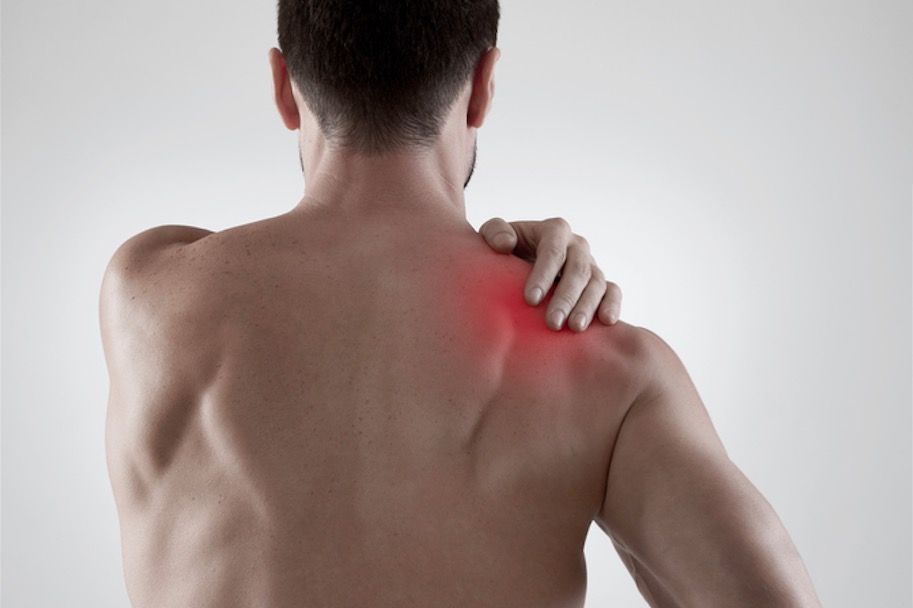 A woman showing her back pain due to muscle soreness.