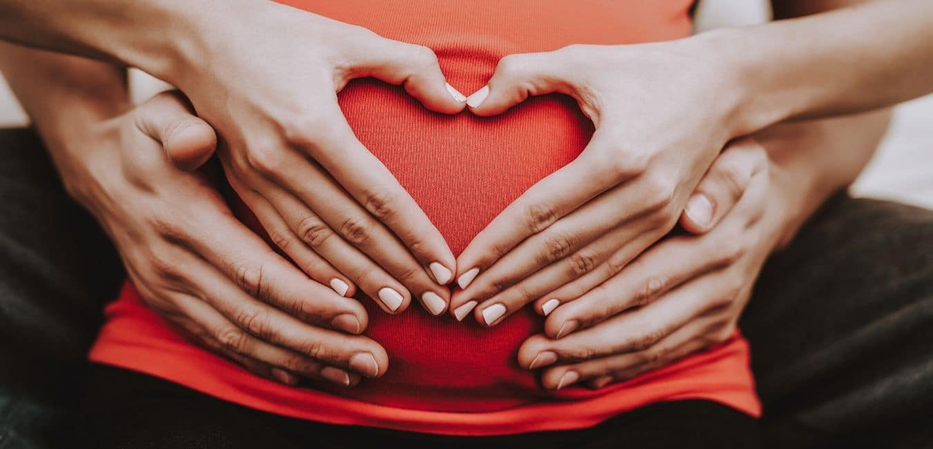 A depiction of a pregnant woman's belly, showcasing the importance of proper care and nutrition. It highlights the connection between maternal health and optimal outcomes for both the mother and baby.