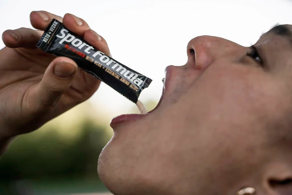 Pouring multivitamin packets into his mouth.